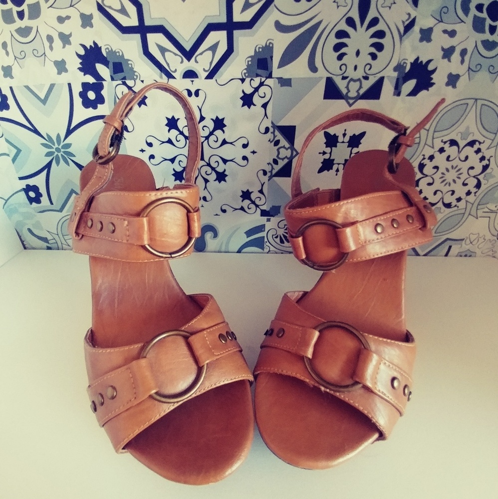 Strapy sandals with a 5 inch heel. Worn once.